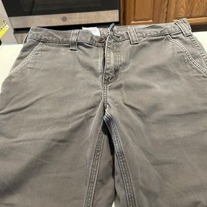 Carhartt mens 33 waist pants. Hemmed see measurements in pic